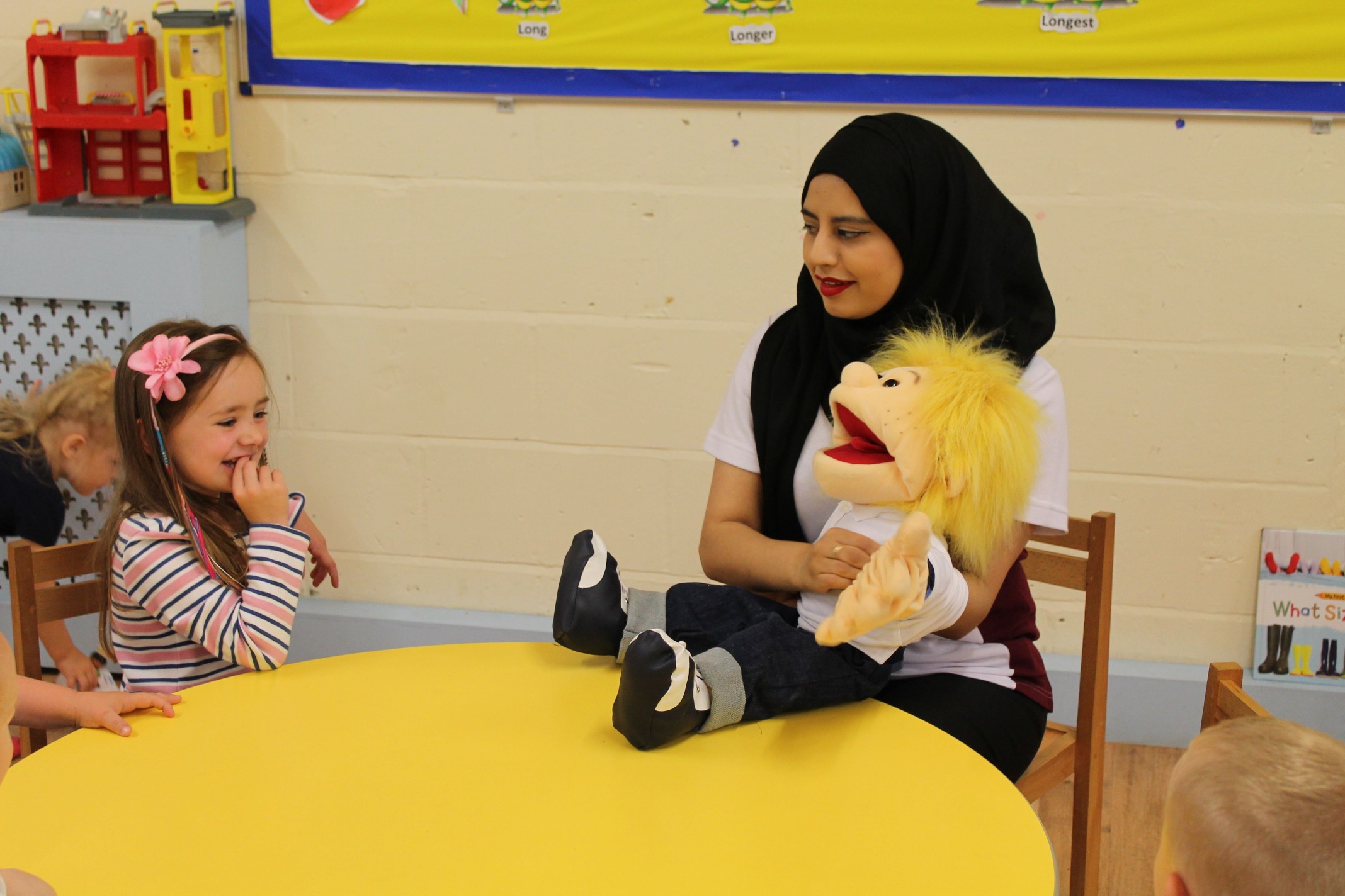 Saliha using puppets to help children develop the ‘p’ sound.