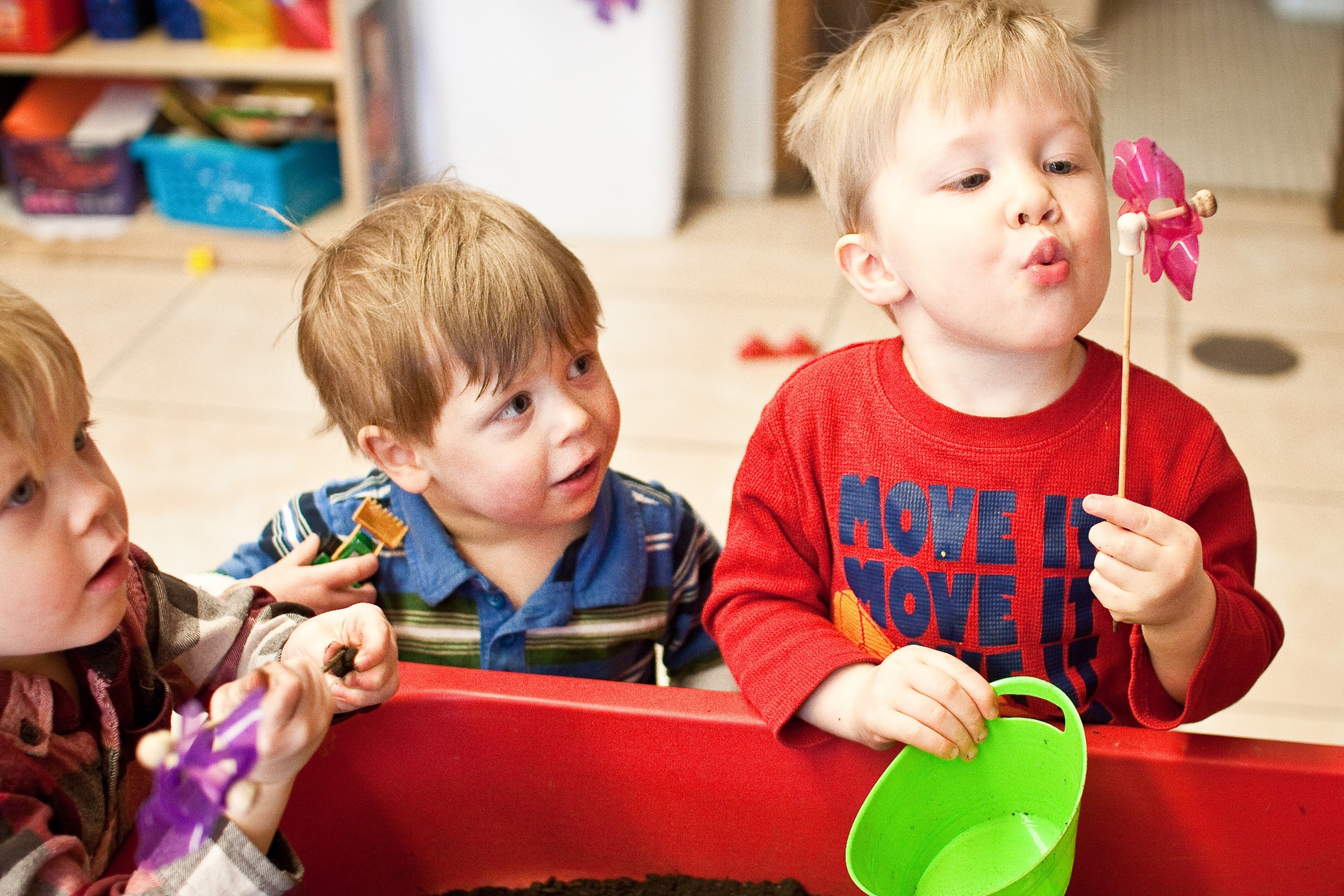 Children using play to develop their vocabulary and turn-taking skills.